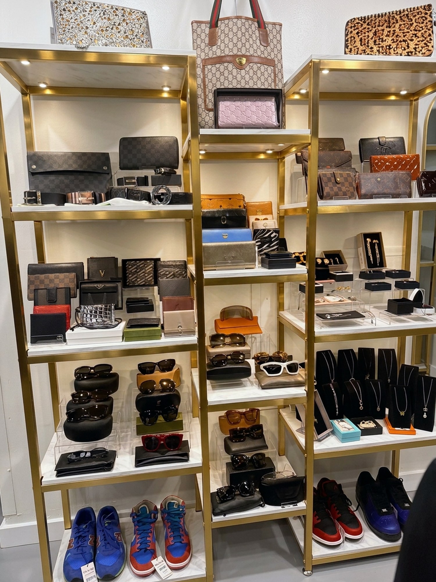 Designer wallets and sunglasses display